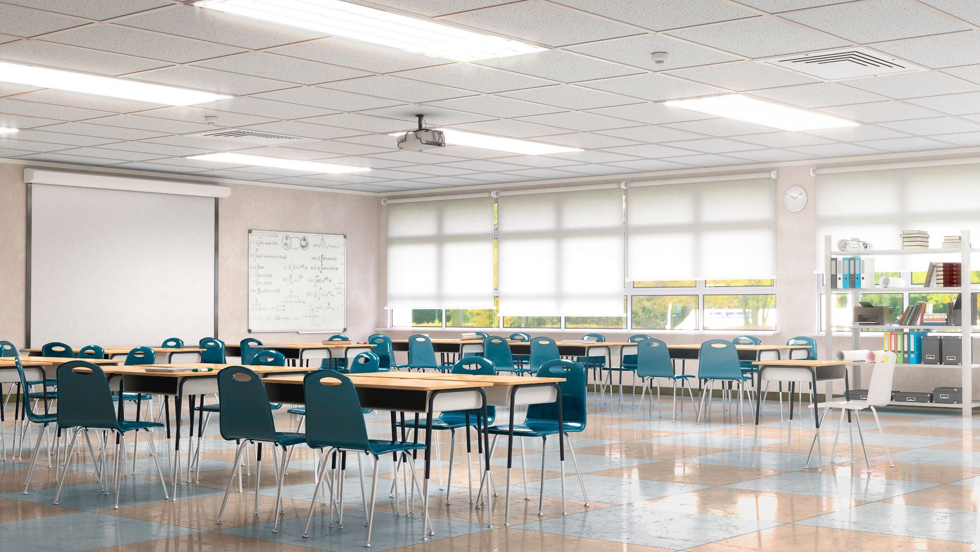 An empty, brightly lit classroom with rows of wooden desks and teal chairs, a whiteboard of equations and a projector screen at the front, and shaded windows along one wall