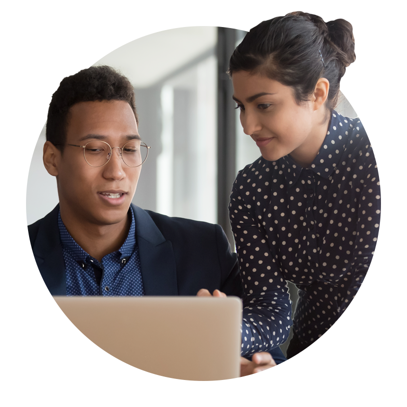 woman coaching man in front of laptop