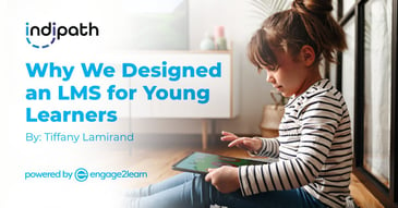 why we designed an lms for young learners text on background of child playing on tablet