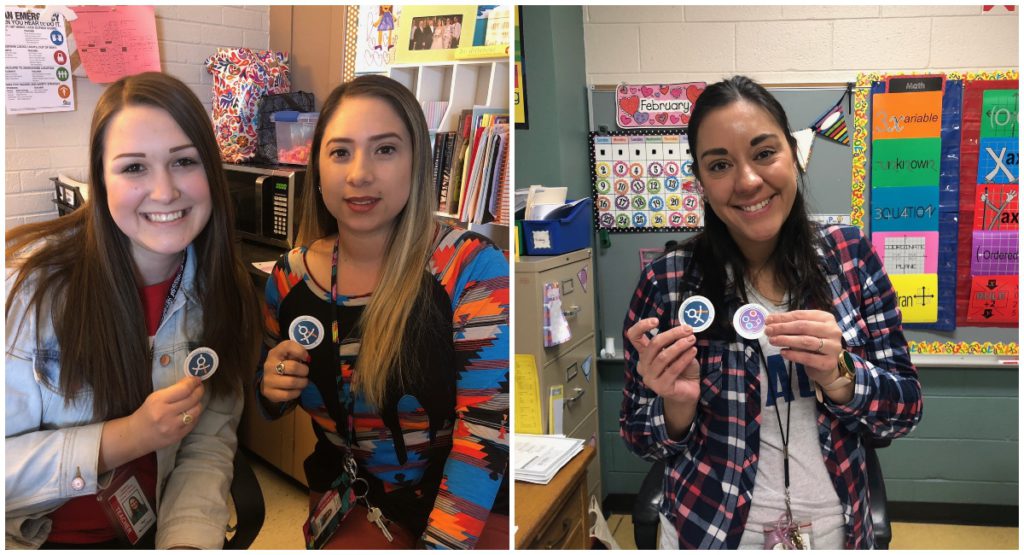 Abilene ISD teachers holding earned progress badges