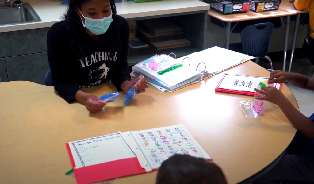 Houston ISD teacher Asia Reed working with her students at an RLA station